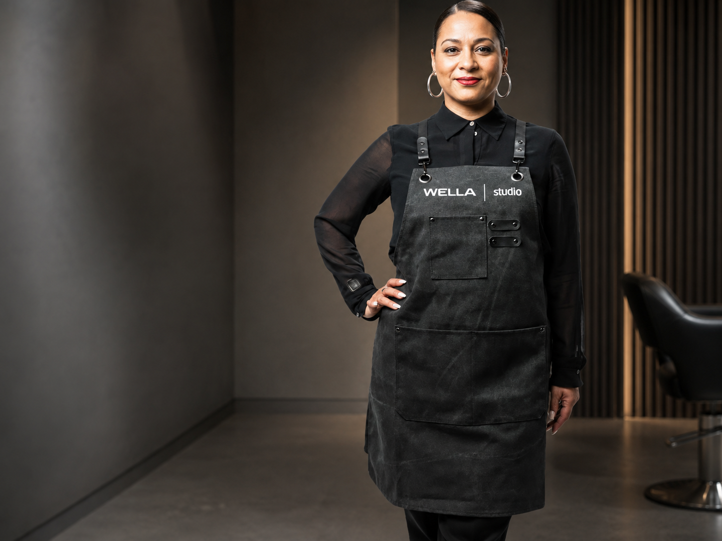 Custom rugged Wella Studio salon apron with utility pockets and metal hardware